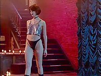 Joanne Going does a down blouse scene wearing a glittery top and panties. Notice her erect nipples showing through the flimsy fabric while she's doing an erotic nightclub dance in this movie clip.
